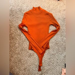 Brown long sleeve turtle neck body suit